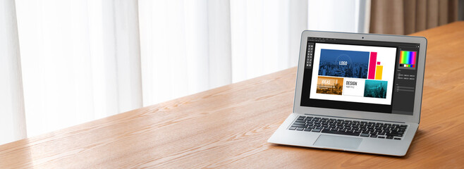 Graphic designer software for modern design of web page and commercial ads showing on the computer screen