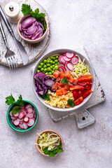 Balanced healthy bowl with vegetables and salmon