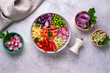 Balanced healthy bowl with vegetables and salmon