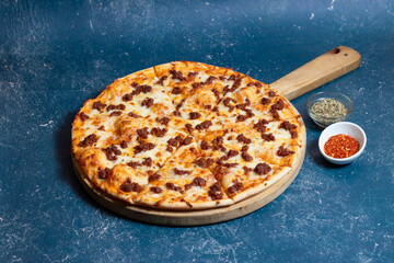 Bolognese Pizza with Mozzarella Cheese isolated on wooden cutting board side view of American food