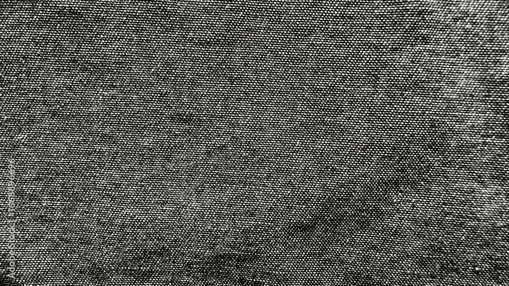 Poster closeup of coarse black linen fabric texture with visible weave pattern suitable for textile backgro