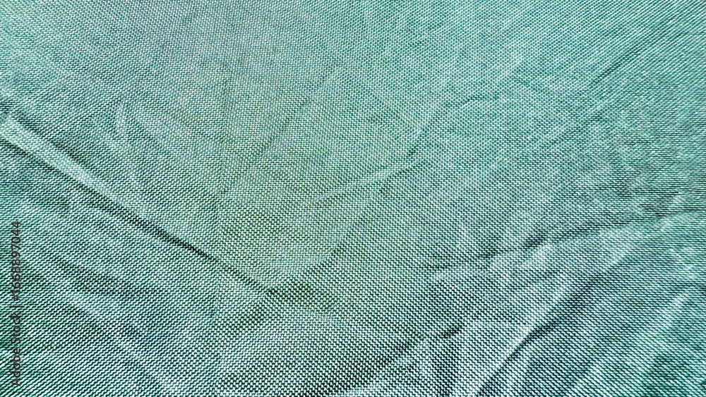 Poster subtle teal woven fabric texture with fine geometric pattern and gentle folds ideal for background o