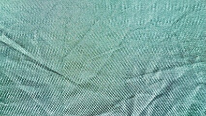 subtle teal woven fabric texture with fine geometric pattern and gentle folds ideal for background or textile design