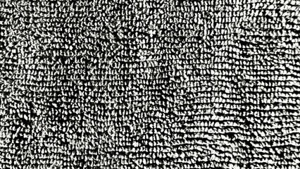 closeup of black and white loop pile carpet surface creating dense textured pattern suitable for modern background or fabric detail