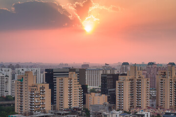 Colorful sunset in Gurgaon urban skyline.Gurugram,Haryana,India cityscape with modern...
