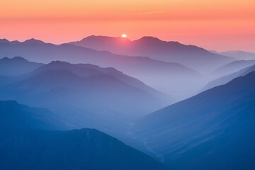 Fototapeta premium Serene Sunset Over Misty Mountain Ranges in Breathtaking Panorama