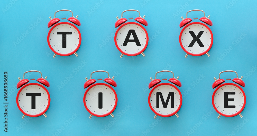 Poster a red alarm clock with the word tax time written on it