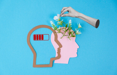 A person's head is shown with a battery icon on it
