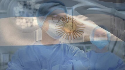 Male surgeon turning toward assistant and guiding medical instruments under Argentine flag overlay - Powered by Adobe