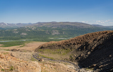 View Panorama of mountain ranges on blue sky