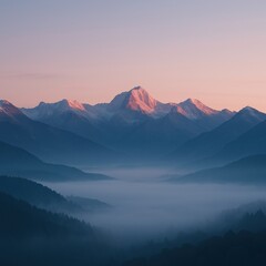 Majestic mountain peaks at sunrise with misty valley