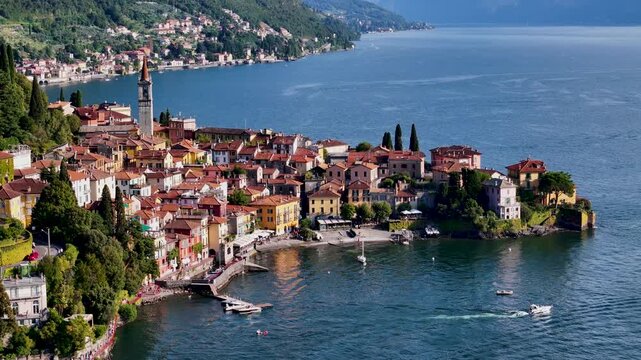 Varenna, Como lake. Picturesque village in Lombardy, Italy. Aerial panoramic 4K drone video footage of beautiful town with colorful houses surrounded by mountains