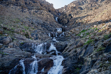 Cascade stone waterfall in a rock gorge