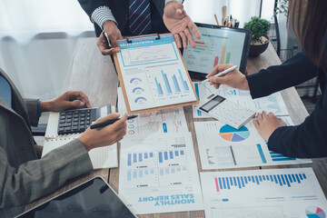 Business team meeting to analyze and discuss the situation in the financial report in the meeting room, investment consultant, financial consultant and accounting consultant.