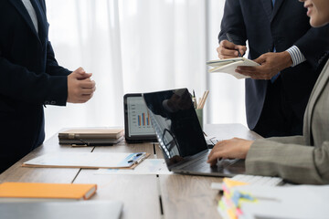 Business Team's Strategic Discussion: A focused business team engages in a collaborative...