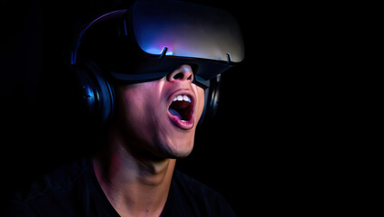 Gamer intensely focused, blue and purple screen reflections in eyes.