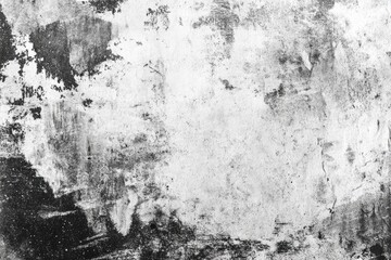 Monochrome abstract texture of heavily distressed, peeling paint on a surface, revealing layers underneath in shades of grey and black