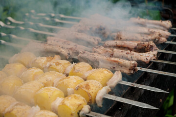 Savor the Delicious Skewers and Enjoy Grilled Potatoes Cooked Over Smoky BBQ Flames