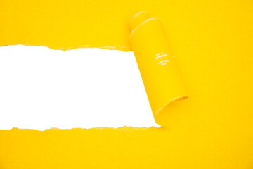 The missing message. Yellow paper torn in half in a strip from the middle.