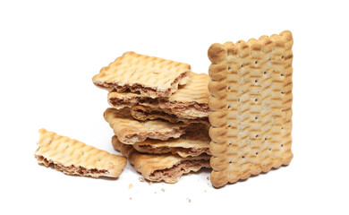 Broken rectangular double color biscuit and crumbs, pile cookies isolated on white, side view