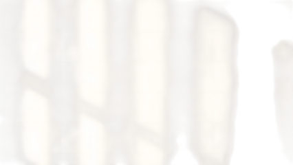 Abstract Architectural Detail: The play of light and shadow on the geometric facade of a modern building create a compelling minimalist composition.