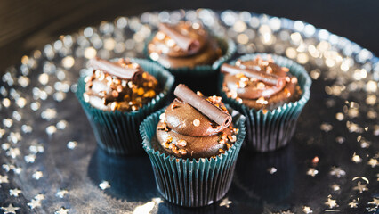 Beautiful assorted chocolate cupcakes with creamy frosting and colorful toppings, styled on a chic plate. Ideal for dessert content, baking inspiration, and joyful food storytelling.