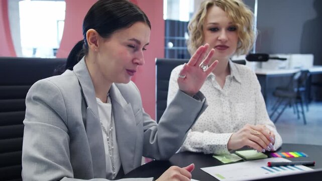 Executives analyzing business insights and performance benchmarking during strategic session