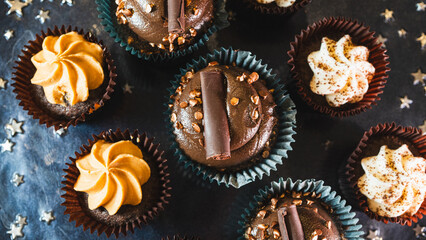 Beautiful assorted chocolate cupcakes with creamy frosting and colorful toppings, styled on a chic plate. Ideal for dessert content, baking inspiration, and joyful food storytelling.