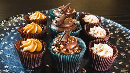 Beautiful assorted chocolate cupcakes with creamy frosting and colorful toppings, styled on a chic plate. Ideal for dessert content, baking inspiration, and joyful food storytelling.