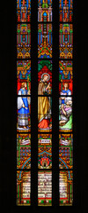 Saint Charles Borromeo giving the Eucharist to the sick during the plague in Milan. Stained-glass window of in St. Martin’s Cathedral, Bratislava.