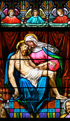 The Pietà – the Virgin Mary holding the body of Jesus after the Crucifixion. Stained-glass window in St Martin's Cathedral, Bratislava, Slovakia.