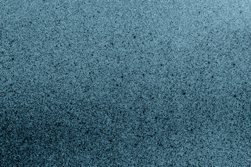 Abstract grunge textured surface in dark blue gradient background