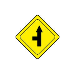 Yellow diamond traffic sign with a black T-shaped symbol, indicating an upcoming T-intersection on the road