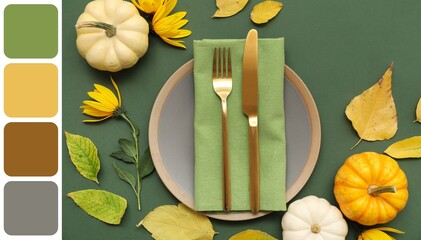 Beautiful table setting with pumpkins, flowers and autumn leaves on green background. Different...