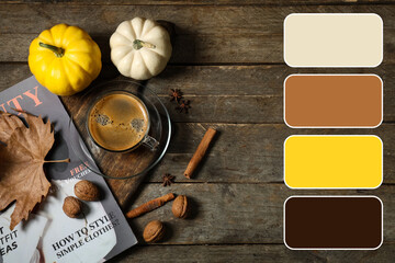 Cup of tasty pumpkin coffee with autumn decorations and magazine on brown wooden background