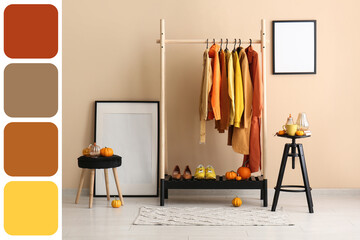 Interior of room with autumn clothes and pumpkins