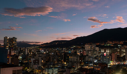 Panoramic view of the northern part of Quito during the evening with the buildings lit up