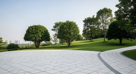 Lush green park with paved pathway and distant city skyline under clear blue sky paving stones trees