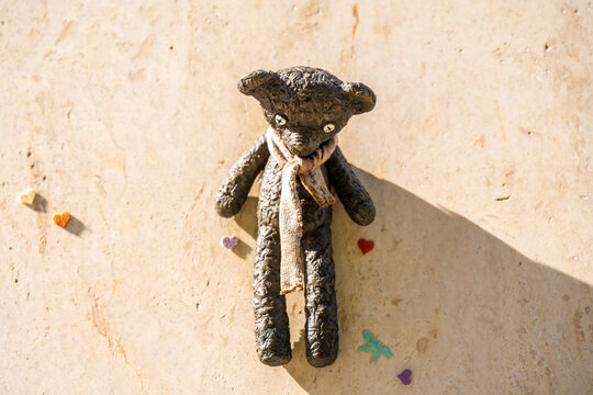 Budapest, Hungary - April 27, 2024: Bronze Mr. Bean's teddy bear mini sculpture by Mihaly Kolodko.