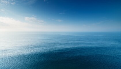 Fototapeta premium calm horizon over tranquil ocean with gentle mist and soft light