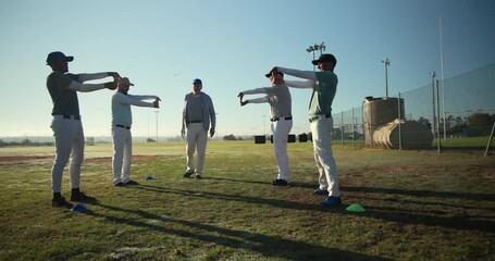 Responding to coach cue, coach guiding team drilling warm-up glove movements on baseball field - Powered by Adobe