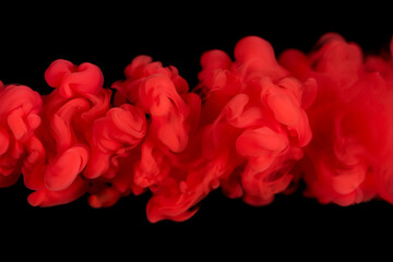 Red Ink Cloud Swirling in Water Against Black smoke