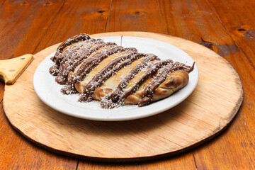 Sweet Chocolate Calzone with Coconut Topping on Plate