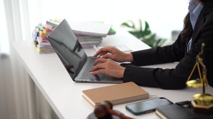 Legal Precision at Work: A professional, focused on crafting a case in a legal office, the scene, with its orderly arrangement of papers and accessories, signifies dedication.