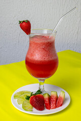Healthy detox berry smoothie with fresh ingredients such as strawberry, watermelon, and lemon, a...