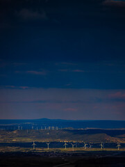 Wind turbines seen from the top of Mount Alaric in the Aude region. Landscapes interspersed with...