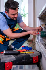 Handyman performs heating system repair in residential space ensuring efficient operation