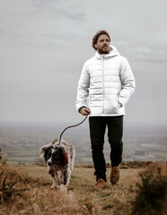 Puffer jacket png transparent mockup, man with dog © Rawpixel.com