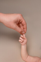 Obraz premium Parent and Baby's First Touch A Tender Moment of Connection