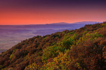 Sunrise from the top of Mount Alaric in the Aude. View from the top of a mountain in the South of France over the Occitanie plain.